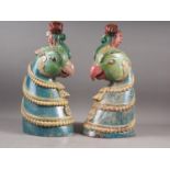 A pair of Thai? carved hardwood painted busts of bird's heads, 18" high