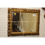 A 19th century rectangular gilt Florentine frame with mirror plate, 13" x 16"