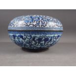 A Chinese cloisonne blue and white circular box and cover with flower, bat and character designs, 12