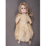 A French Tete Jumeau porcelain headed doll, 11" high overall