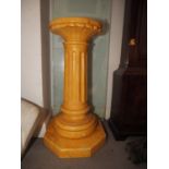 A finished as Sienna marble pedestal with foliate capital and fluted column, on shaped base, 31"