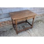 A late 18th century oak centre table, fitted one drawer, on bobbin turned and stretchered
