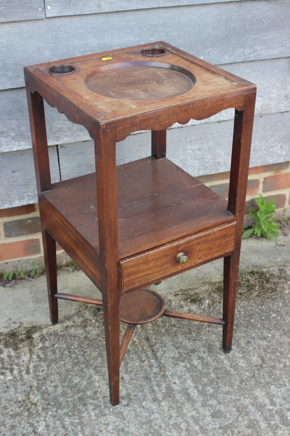 A 19th century mahogany washstand, fitted one drawer, on square taper supports, 15" square x 30 1/2"