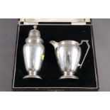 A silver sugar caster with matching milk jug, in fitted case, 6oz troy approx