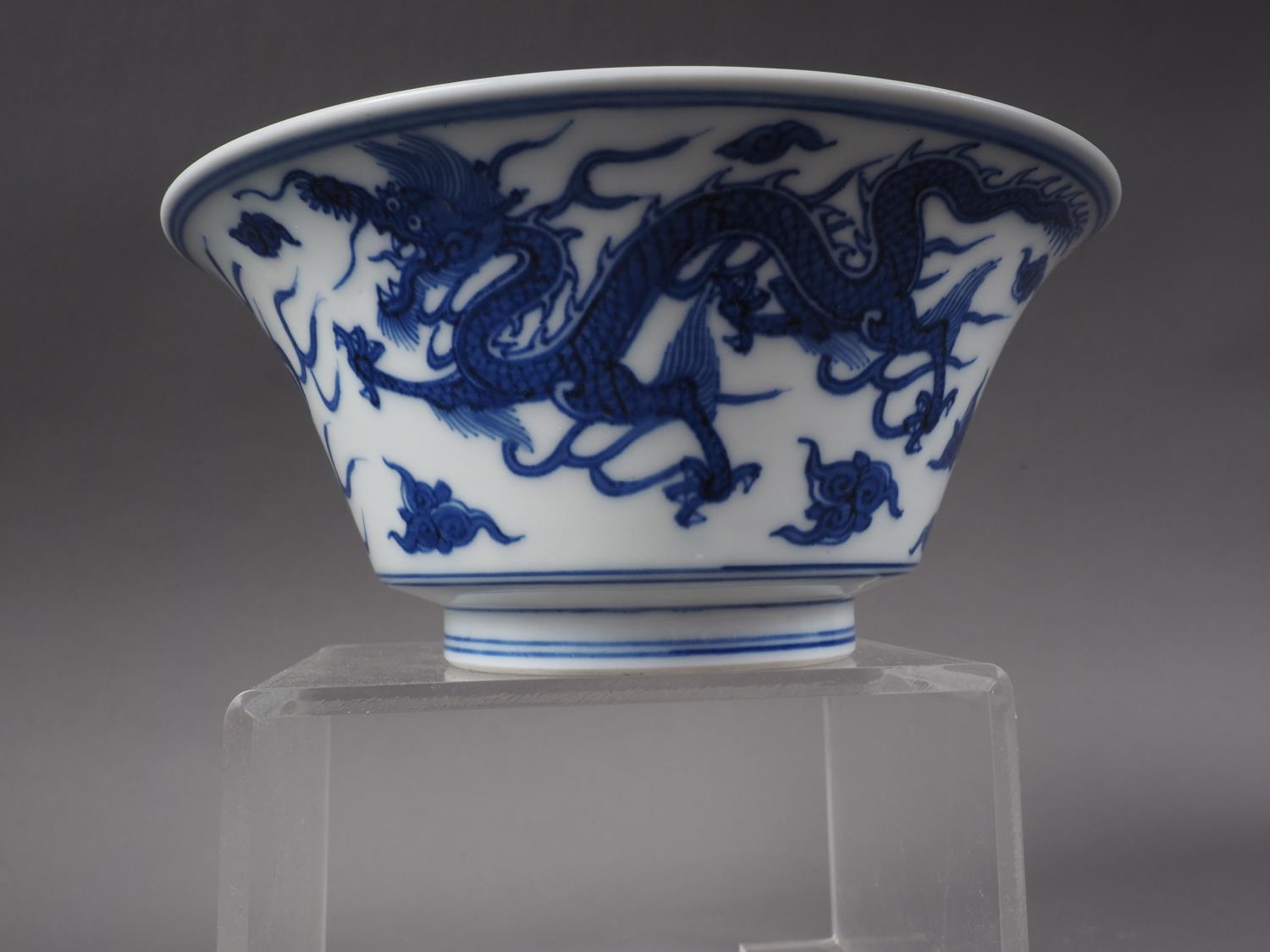 *A Chinese blue and white bowl with exterior dragon, cloud and flaming pearl decoration, and - Image 3 of 5