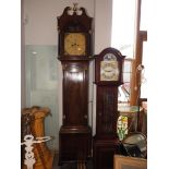 A George III figured mahogany and ebony line inlaid archtop long case clock with painted Adam and
