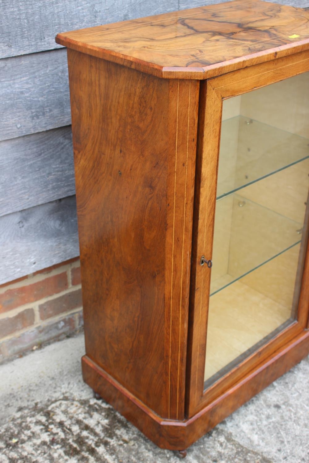 A 19th century walnut an line inlaid side cabinet with two glazed shelves enclosed glazed door, on - Image 2 of 2