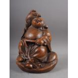 A Japanese carved bamboo figure of a Buddha, 7 1/4" high