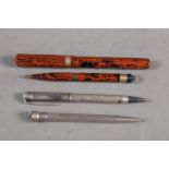 A 1930s "Seal" pen and pencil set with 18K nib, a silver propelling pencil and one other