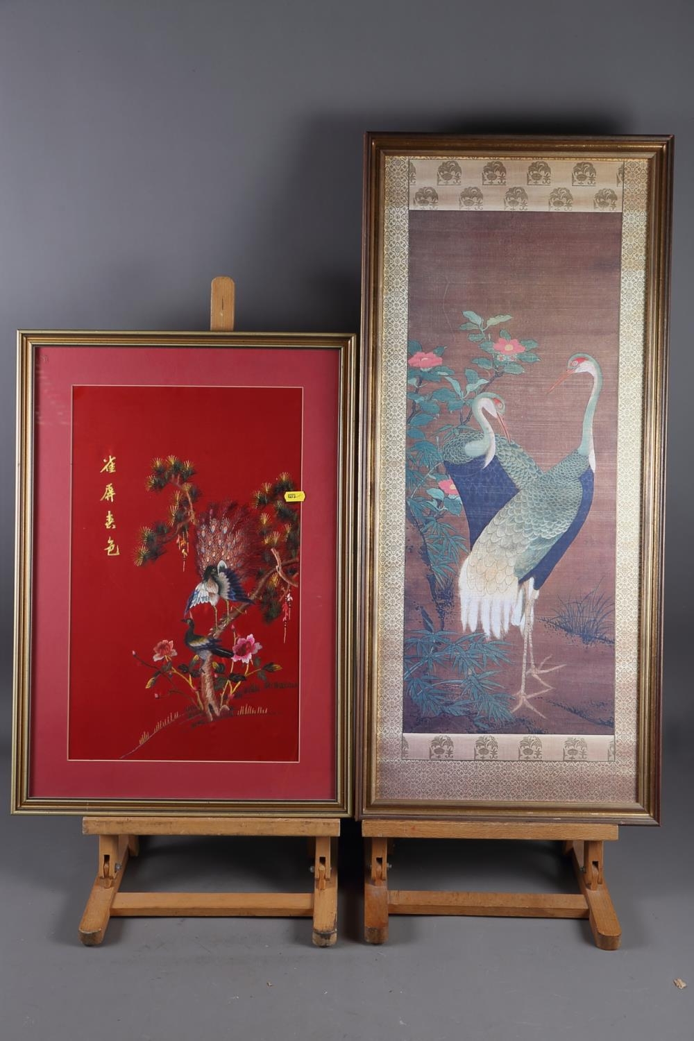 A Chinese silk embroidered panel of peacocks, 11" x 18", in strip frame, and a print of cranes, in