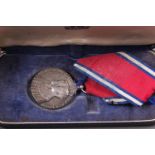 A George V and Queen Mary Silver Jubilee medal, in associated medal box