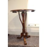 A Swan and Millican Patent Choral and Band oak adjustable table, on turned column and tripod splay