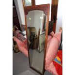 A pine framed rectangular wall mirror with fan finial, 25" x 15 1/2", another mahogany wall mirror