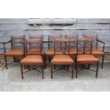 A set of eight 19th century mahogany and satinwood banded 'X' shape bar back dining chairs with