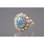 A yellow metal and opal cluster ring, size O, 4.7g