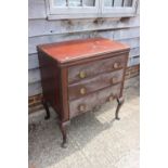 A walnut chest of three long drawers with ring handles, on cabriole supports, 32" wide x 20" deep