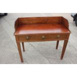 A 19th century Scandinavian mahogany tray top washstand, fitted two drawers, on square taper