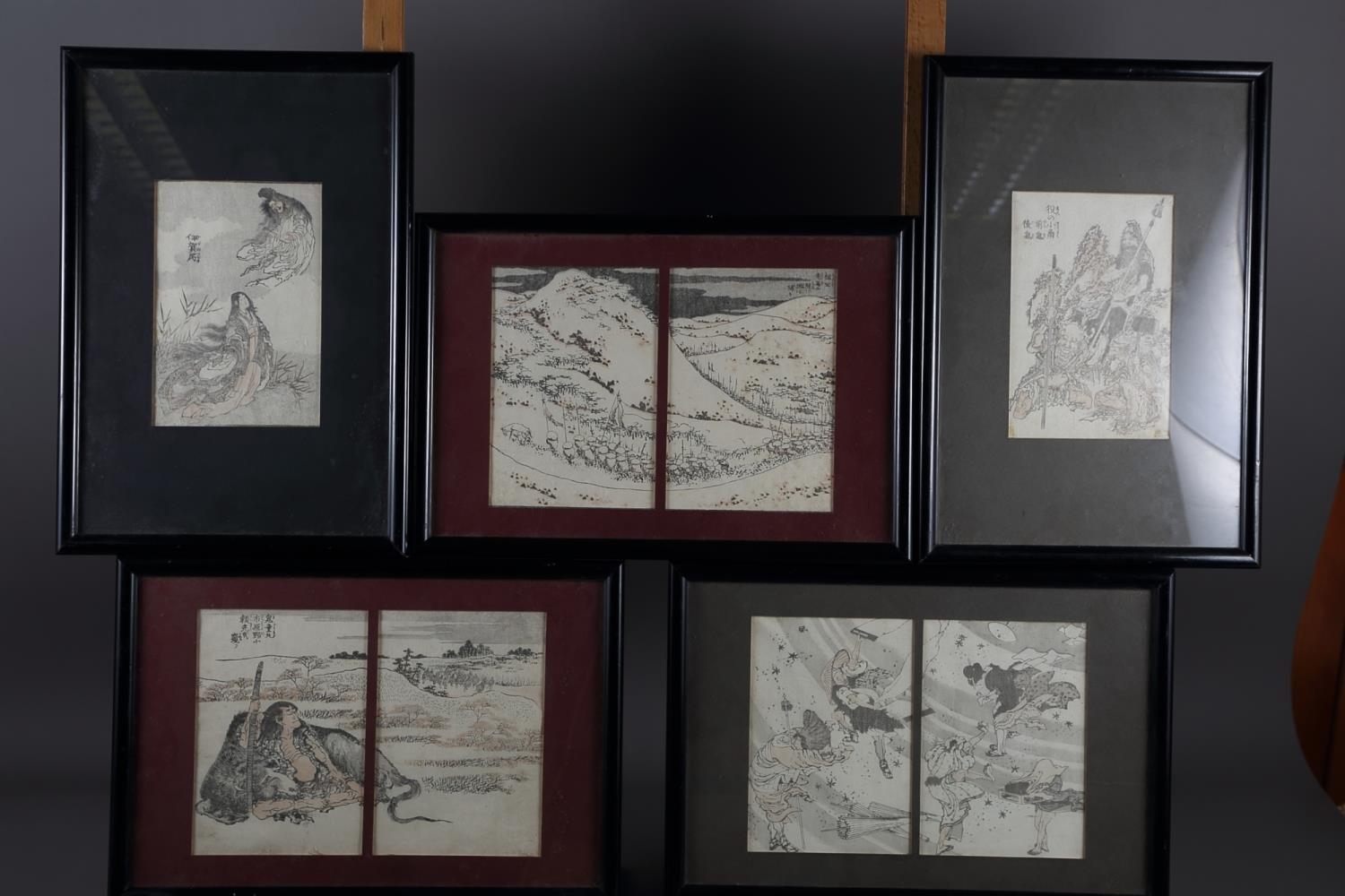 *A set of three Japanese prints, figures in landscape, in ebonised frames, and another similar