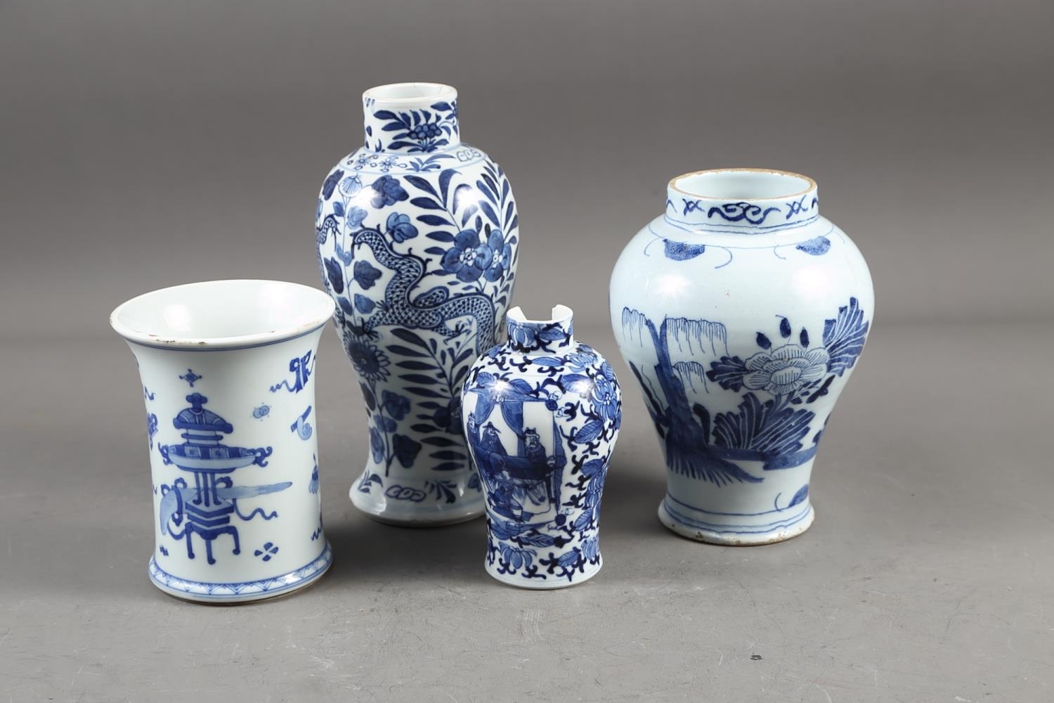 A Chinese blue and white baluster vase with dragon and flower decoration, four-character mark to