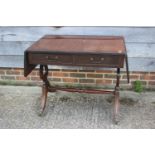 A mahogany and banded sofa table, fitted two drawers, on shaped supports, 36" wide x 21" deep x 30