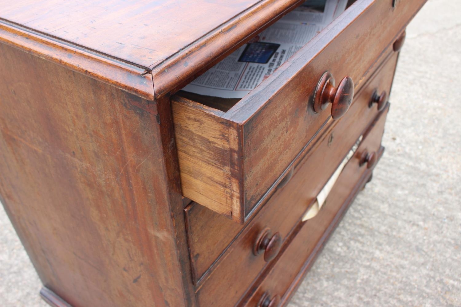 A 19th century mahogany chest of four long graduated drawers with knob handles, on turned - Image 3 of 4