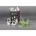 A miniature display cabinet, containing a collection of crested ware, a 19th century Staffordshire