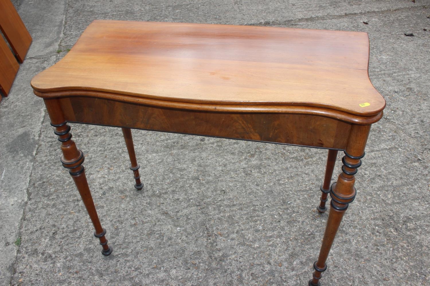 A late 19th century Scandinavian fold-over top serpentine front tea table, on ebonised banded