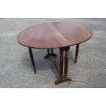 A late 19th century walnut Sutherland tea table, on slender reeded supports