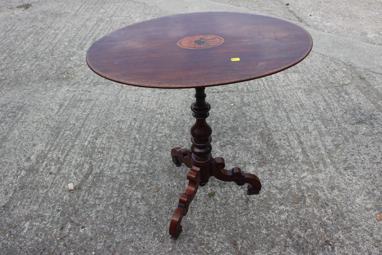 A late 19th century walnut and inlaid oval top occasional table, on turned column and tripod