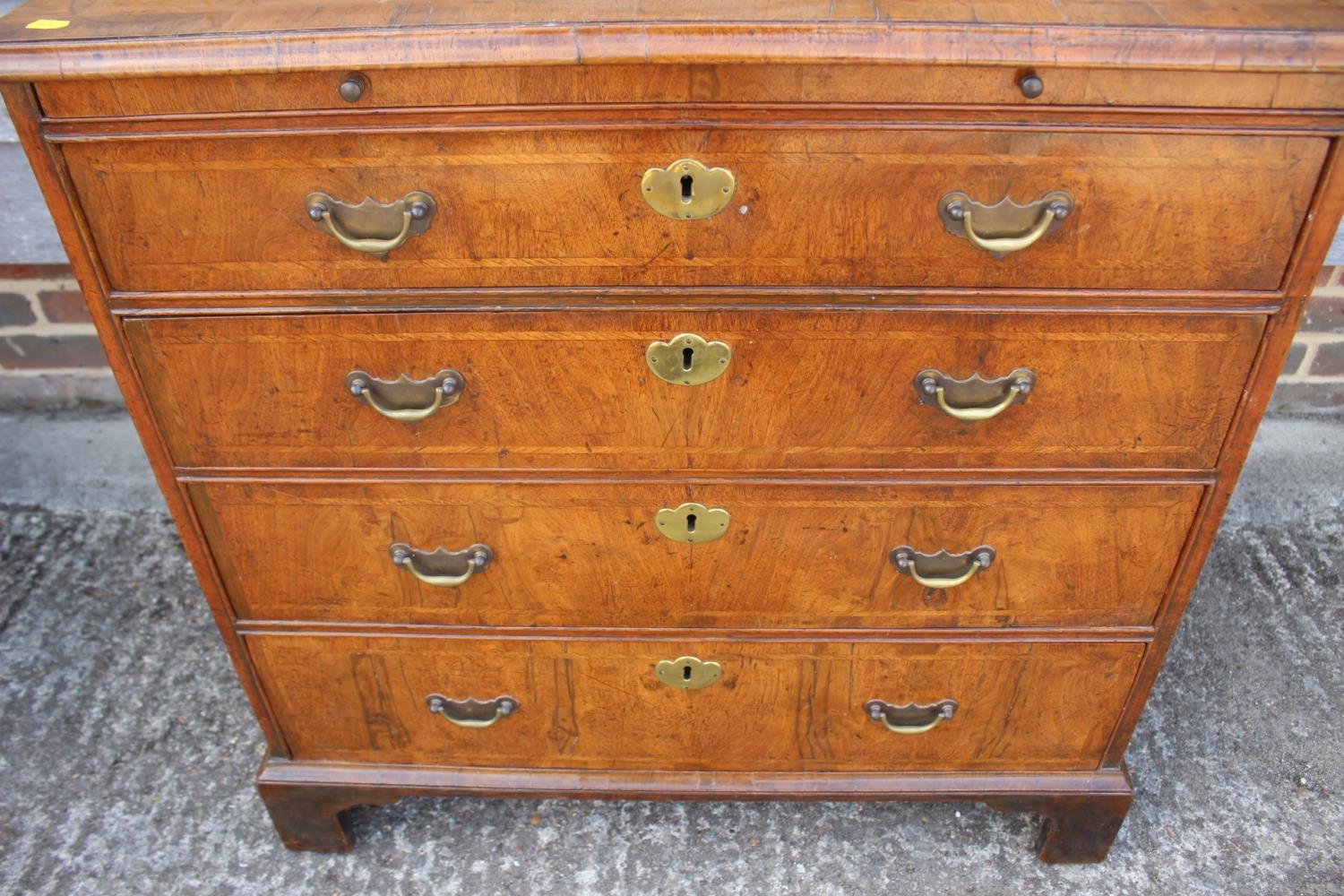 A bachelor's figured walnut and feather banded chest, fitted slide over four long graduated drawers, - Image 3 of 7