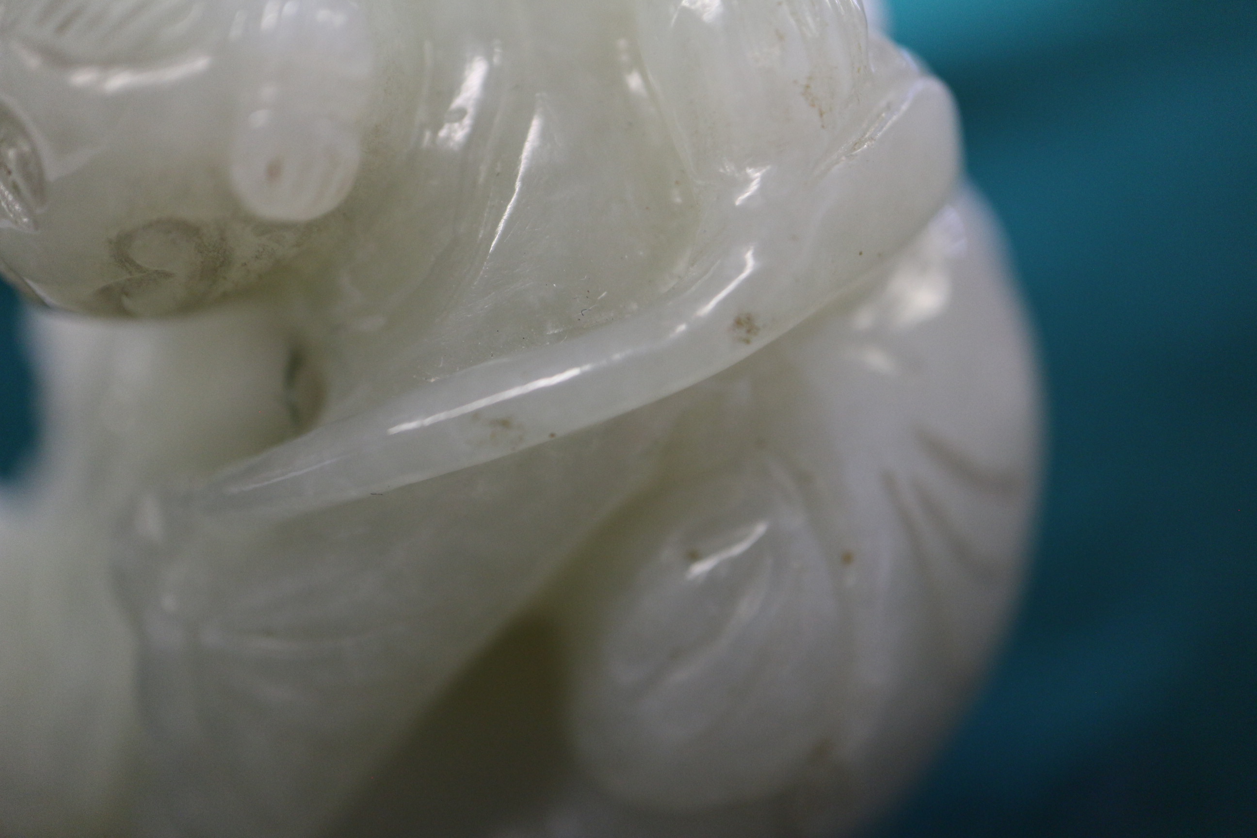 A Chinese carved pale jade pendant, 2 1/4" dia, with stand - Image 4 of 14