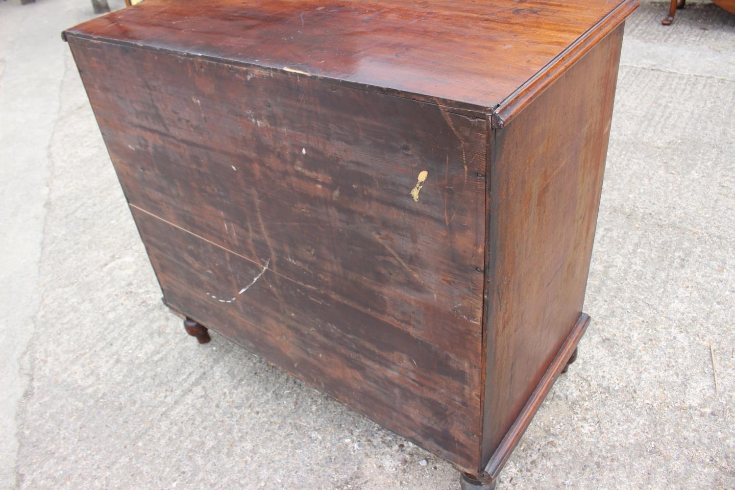 A 19th century mahogany chest of four long graduated drawers with knob handles, on turned - Image 4 of 4