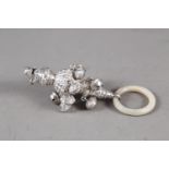 A Victorian silver rattle and whistle with mother-of-pearl teething ring