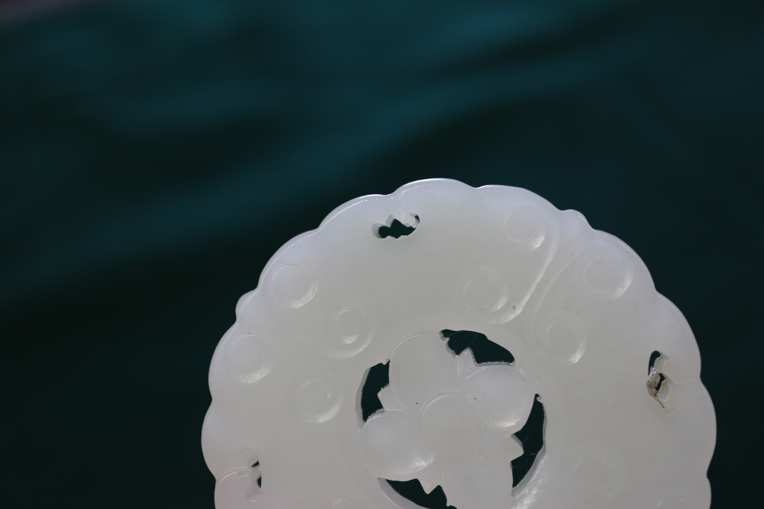 A Chinese carved pale jade pendant, 2 1/4" dia, with stand - Image 5 of 14