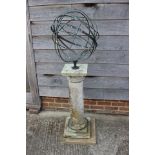 An armillary sphere, mounted on a square base, 27" high, sphere 18" dia