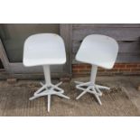 A pair of Kartell spoon stools, by Antonio Citterio