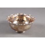 A Mexican white metal bowl with embossed scrolled rim, stamped Sterling, 11.8oz troy approx