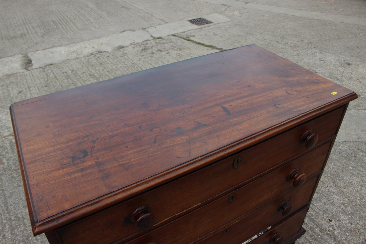 A 19th century mahogany chest of four long graduated drawers with knob handles, on turned - Image 2 of 4