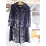 A black musquash fur three-quarter length coat