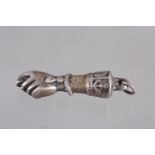 A white metal pendant charm, formed as a Mano Figa, 1 1/4" long