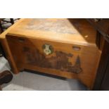 An Oriental carved camphor wood chest, 36" wide