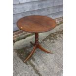 A 19th century provincial mahogany circular tilt top occasional table, on tripod splay supports, 24"