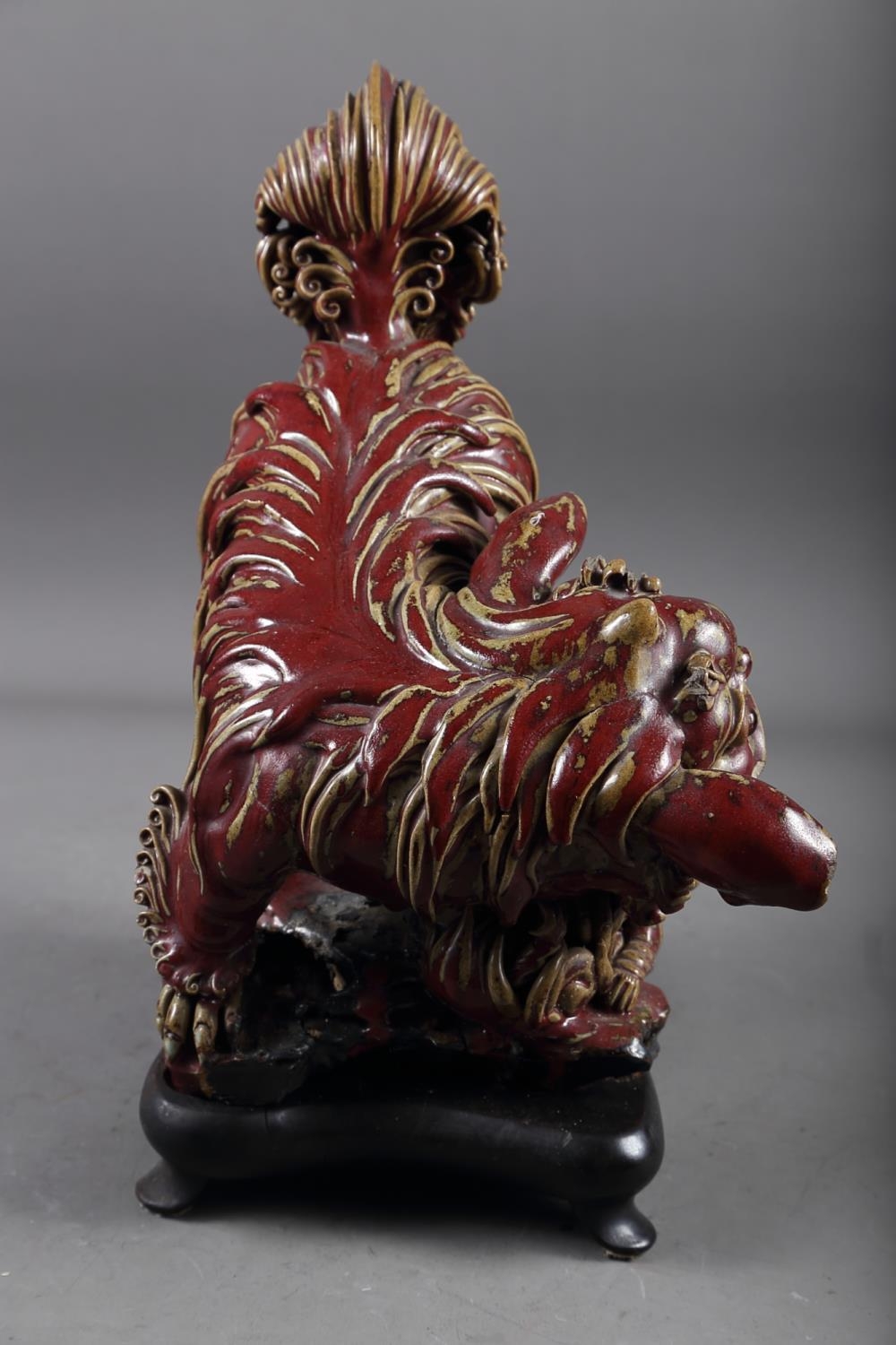 A Chinese red and brown glazed porcelain model of a Dog of Fo, on hardwood stand, 16" high - Image 3 of 17