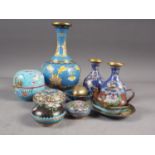 A Chinese cloisonne bulbous bottle neck vase with floral and scrolled designs on a blue ground, 8"