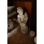 A cast stone figure of a girl holding a dove, 36" high