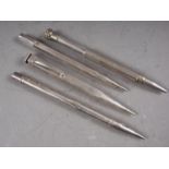 Three silver propelling pencils and a similar silver plated pencil