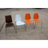 A set of three 1970s laminate dining chairs, on chrome supports, and a similar oak chair