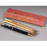 A Cross rolled gold biro, a Parker propelling pencil and two other biros