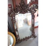 A carved hardwood framed wall mirror of mid 18th century design, 31" x 51" overall