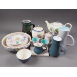 A selection of Poole pottery, including a teapot, two cameo ware coffee pots, a biscuit barrel and